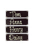 Four dark chocolate bars with names piped in white chocolate. On  white background.