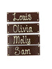 Four dark chocolate bars with names piped in white chocolate. On  white background.