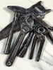 Chocolate tools with edible metallic lustre on white background