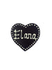 Dark chocolate heart with Elana piped in white chocolate. On a white background.