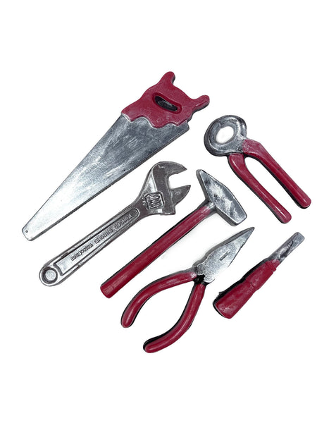Realistic dark chocolate tools with red handles on a a white background.