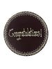 Dark chocolate plaque hand piped  with a decorative border and 'Congratulations!' text in white chocolate. On a white background.