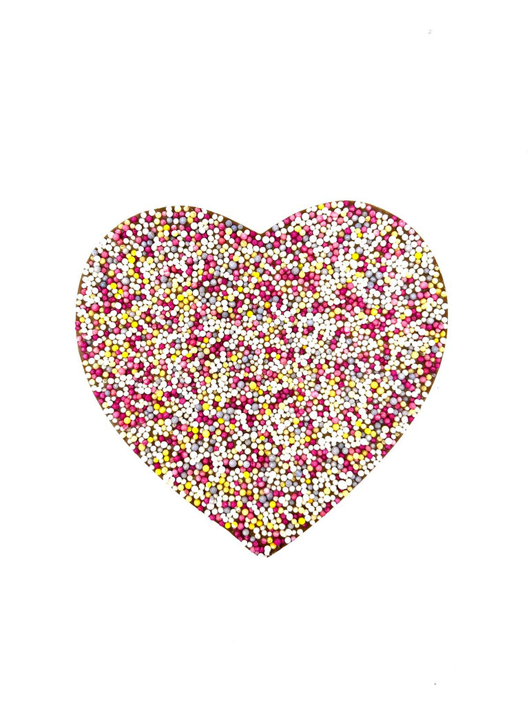 Milk chocolate heart decorated red, white and pink sugar sprinkles. On a white background