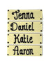 Four white chocolate bars with names piped in dark chocolate. On  white background.