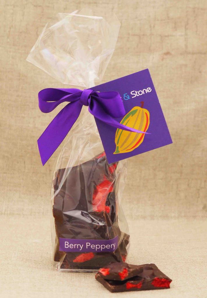 Clear bag of Berry Peppery dark chocolate shards tied with a ribbon.